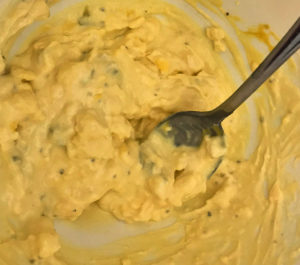 Remove the yolks and mash them up in a small bowl with mayonnaise, mustard, and relish.
