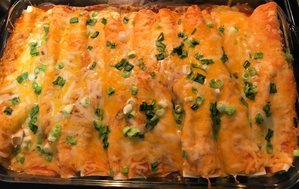 Bake beef enchiladas until cheese is fully melted.