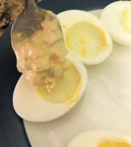 Add the yolk mixture to the egg whites for deviled eggs.