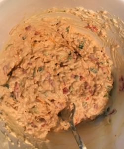 Stir all ingredients together for creamy pimento cheese spread